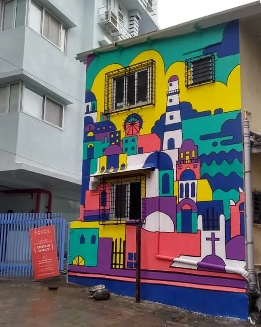 Wicked broz artist designed this tribe stays hostel main area wall art with bright colours