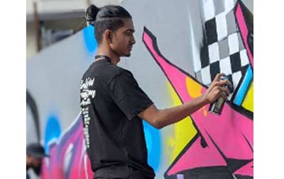 Deepholic graffiti artist at a graffiti festival in Mizoram